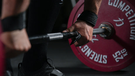 Deadlift Bar vs. Power Bar: Which Barbell Should You Buy?